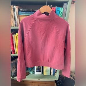 Pink mock sweatshirt.